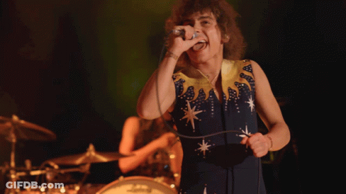 Woman Singing In Blue And Yellow Dress GIF