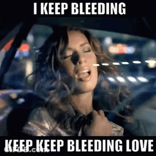 Woman Singing In Car I Keep Bleeding Love GIF
