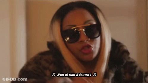 Woman Singing In French With Sunglasses And Fur Coat GIF