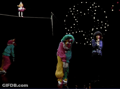 Woman Singing In Front Of Clowns On A Rope GIF
