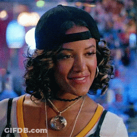 Woman Singing In Front Of Texas Sign GIF