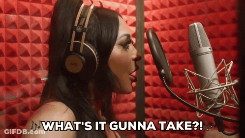 Woman Singing Into Mic Saying What's It Gunna Take GIF