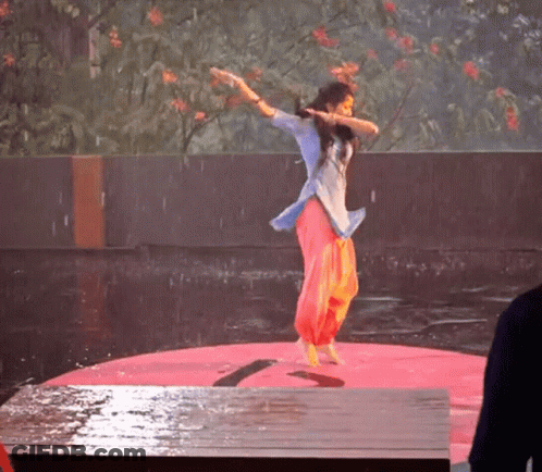 Woman Singing Into Microphone And Dancing GIF