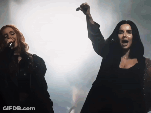 Woman Singing Into Microphone Arm In Air GIF