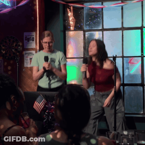 Woman Singing Into Microphone At Imperial Hotel GIF