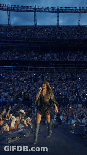Woman Singing Into Microphone At Stadium GIF