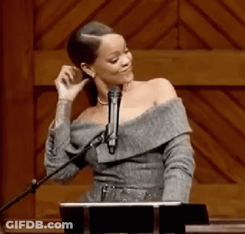 Woman Singing Into Microphone At Wooden Podium GIF