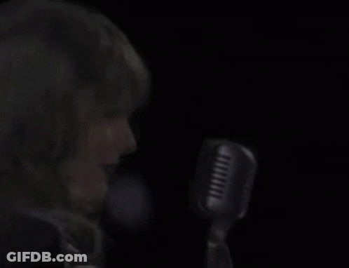 Woman Singing Into Microphone Eyes Closed GIF