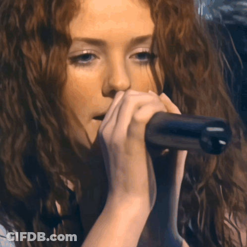 Woman Singing Into Microphone Eyes Closed GIF
