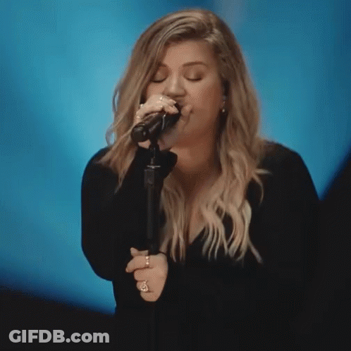 Woman Singing Into Microphone Eyes Closed GIF