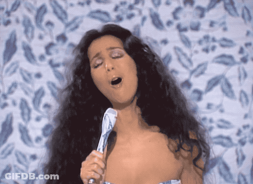 Woman Singing Into Microphone Eyes Closed GIF