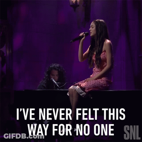 Woman Singing Into Microphone I've Never Felt This Way For No One GIF