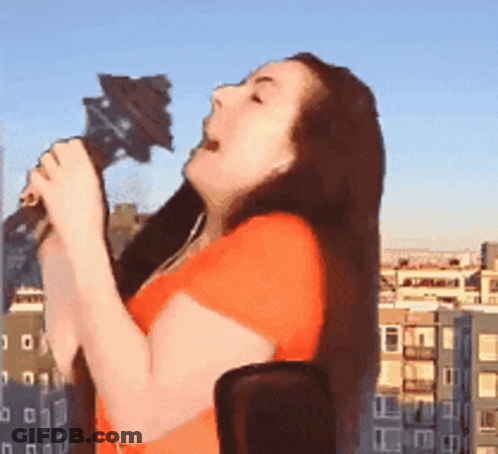 Woman Singing Into Microphone In Front Of City GIF