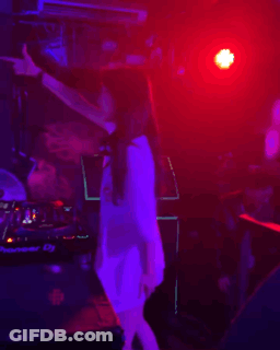 Woman Singing Into Microphone In Front Of Pioneer DJ Machine GIF
