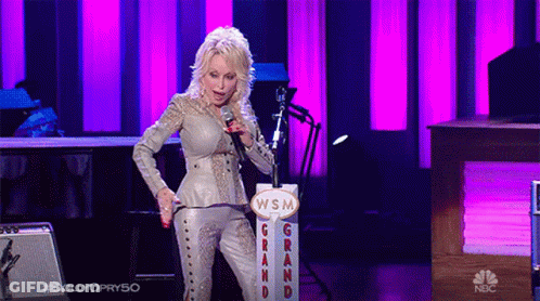 Woman Singing Into Microphone In Front Of WSM Sign GIF