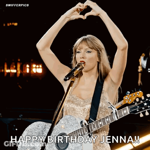 Woman Singing Into Microphone Making Heart Shape Holding Guitar GIF