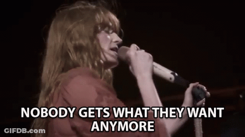 Woman Singing Into Microphone Man Playing Piano GIF