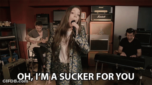 Woman Singing Into Microphone Oh I'm A Sucker For You GIF