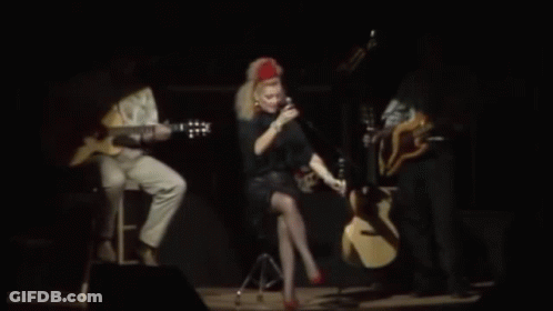 Woman Singing Into Microphone On Stage GIF