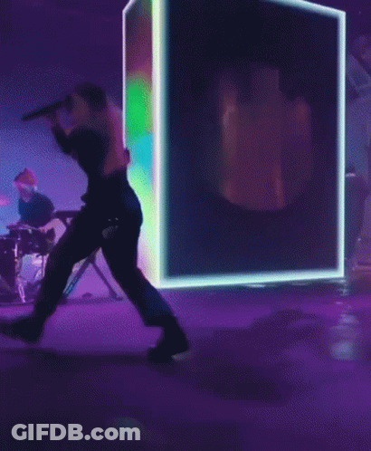 Woman Singing Into Microphone On Stage GIF