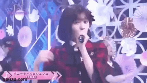 Woman Singing Into Microphone On Stage GIF