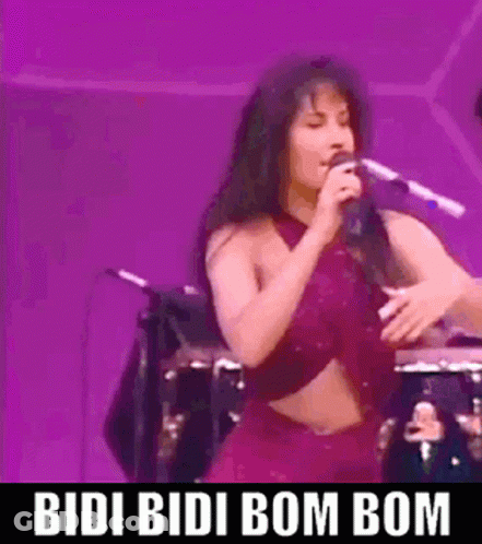 Woman Singing Into Microphone On Stage GIF