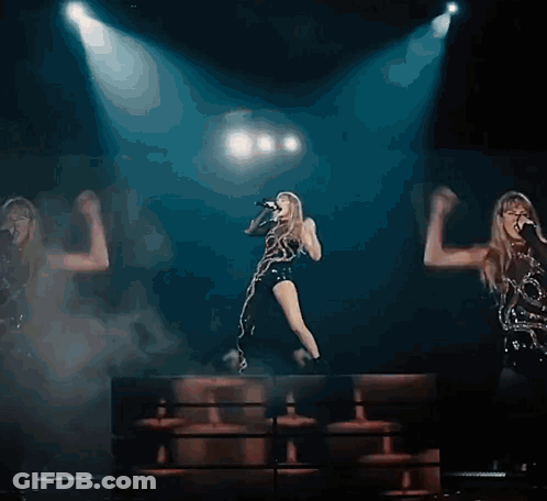 Woman Singing Into Microphone On Stage GIF