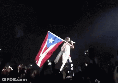 Woman Singing Into Microphone On Stage GIF