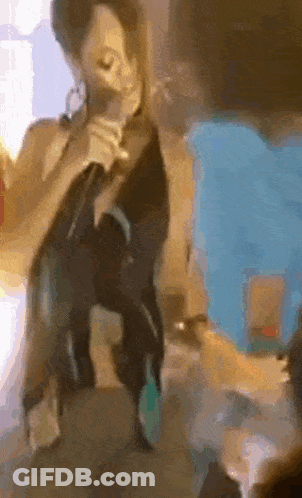 Woman Singing Into Microphone On Table GIF