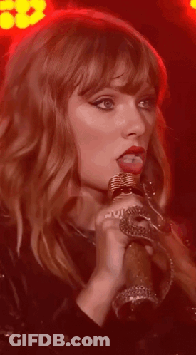Woman Singing Into Microphone Red Lights GIF