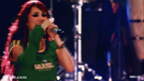 Woman Singing Into Microphone Saying Brasil GIF