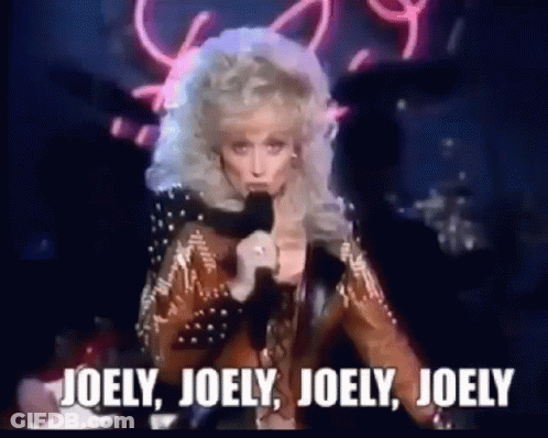 Woman Singing Into Microphone Saying Joely Joely Joely GIF