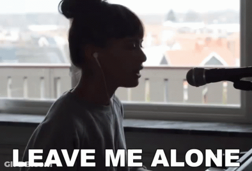 Woman Singing Into Microphone Saying Leave Me Alone GIF