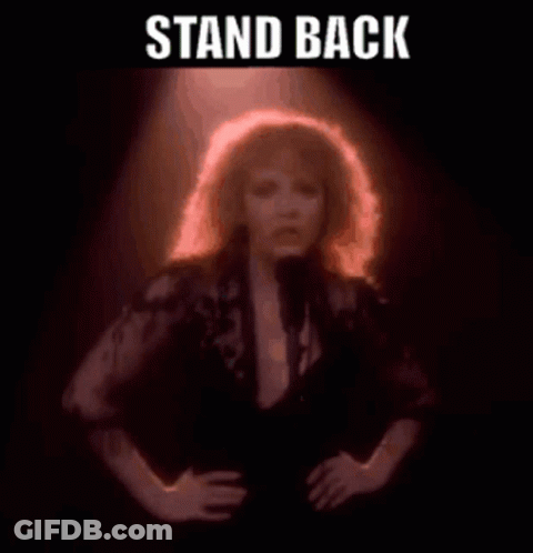 Woman Singing Into Microphone Saying Stand Back GIF
