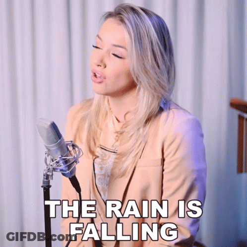 Woman Singing Into Microphone The Rain Is Falling GIF