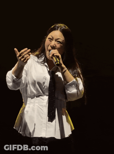 Woman Singing Into Microphone White Shirt And Tie GIF