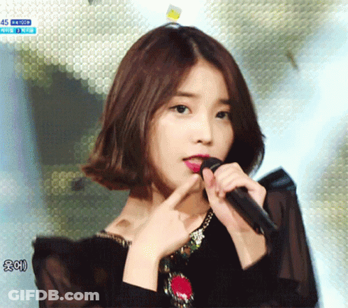 Woman Singing Into Microphone With 45 GIF