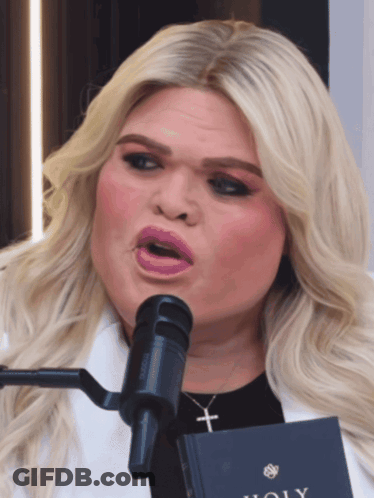 Woman Singing Into Microphone With Holy Book GIF