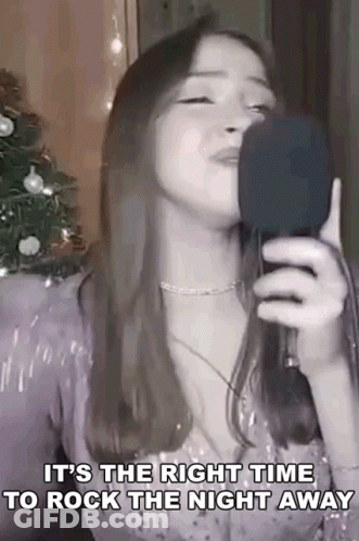 Woman Singing Into Microphone With Lyrics GIF