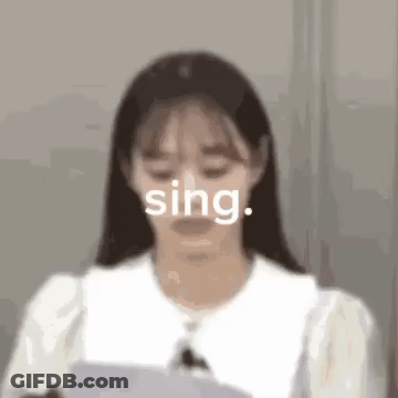 Woman Singing Into Microphone With Paper GIF
