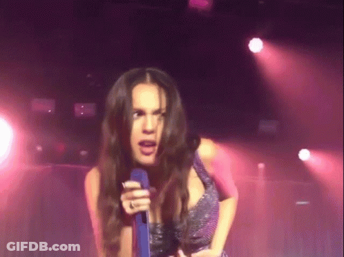Woman Singing Into Microphone With Ring GIF