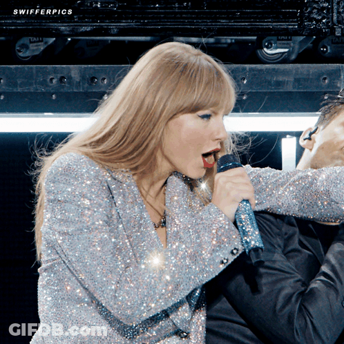 Woman Singing Into Microphone With Swifter Pics GIF