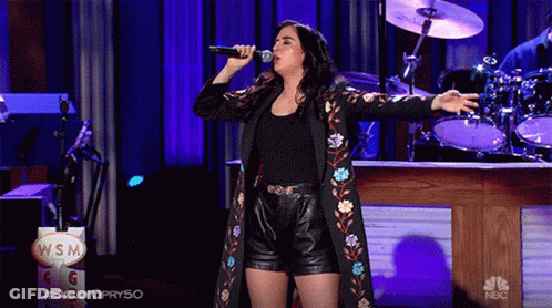 Woman Singing Into Microphone Wsm Sign GIF