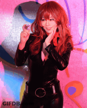 Woman Singing Into Purple Microphone GIF