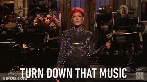 Woman Singing On Stage Saying Turn Down That Music GIF