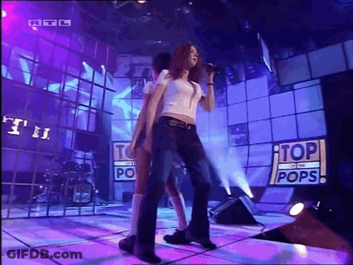 Woman Singing On Stage Top Of The Pops GIF