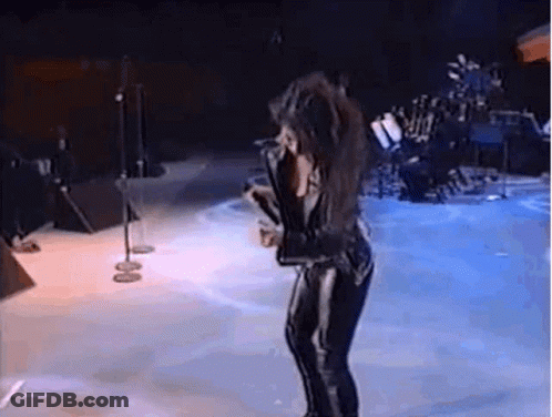 Woman Singing On Stage With Microphone GIF