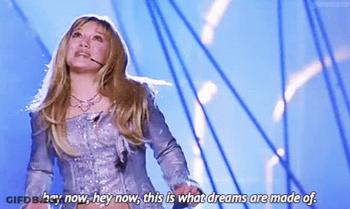 Woman Singing With Microphone On Stage GIF