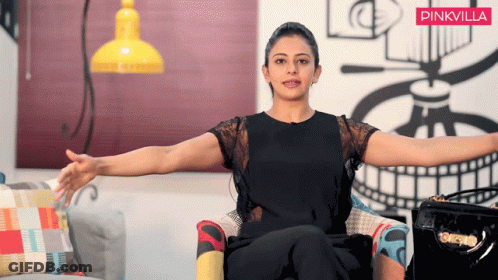 Woman Sitting Arms Outstretched Pinkvilla Banner GIF