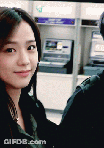 Woman Sitting At ATM With 'A' Sticker GIF